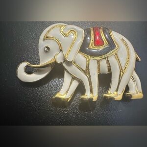 Vintage gold-tone elephant with white  & red enamel  brooch